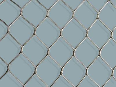 A piece of hand woven stainless steel rope mesh on the gray background.