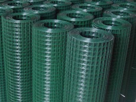 Green PVC coated cage wire mesh rolls in our warehouse.